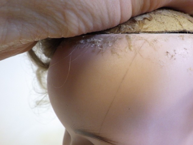 A Hertel Schwab and Co bisque socket head flirty doll Image