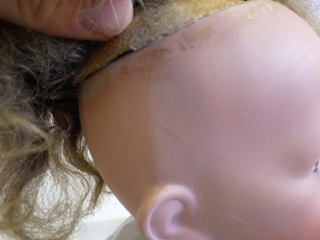 A Hertel Schwab and Co bisque socket head flirty doll Image