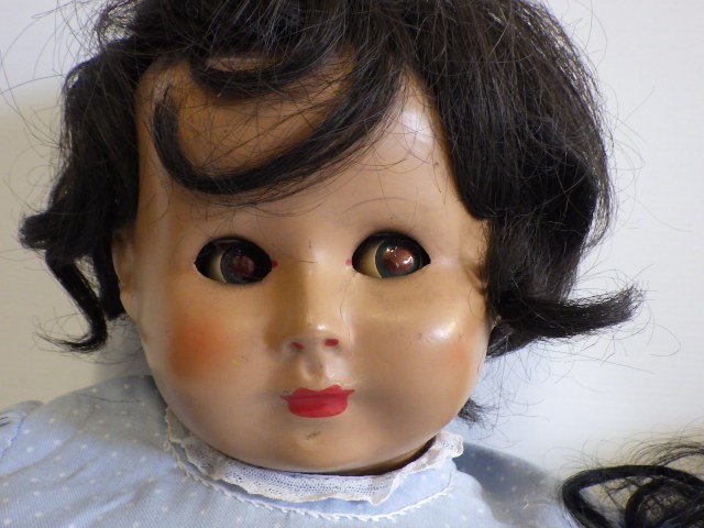 A composition socket head flirty doll Image