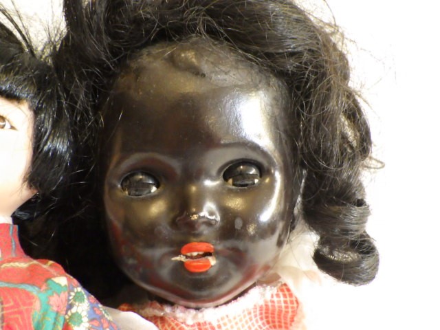 A composition socket head flirty doll Image