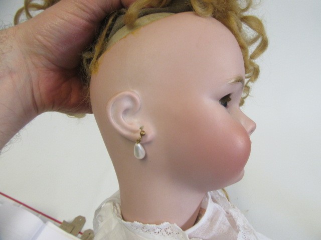 A bisque socket head doll Image