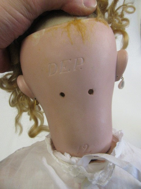A bisque socket head doll Image