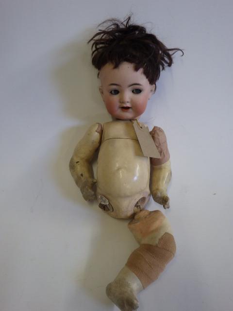 A Kammer & Reinhardt bisque socket head flirty doll Image
