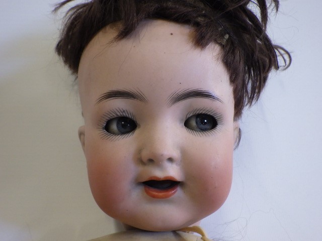 A Kammer & Reinhardt bisque socket head flirty doll Image
