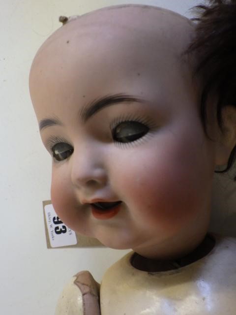 A Kammer & Reinhardt bisque socket head flirty doll Image