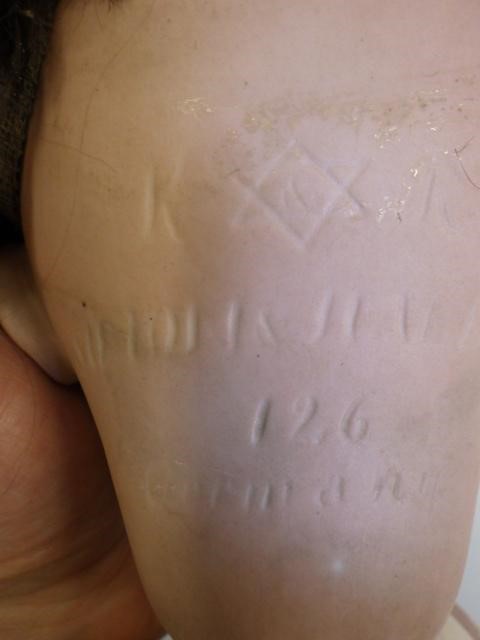 A Kammer & Reinhardt bisque socket head flirty doll Image