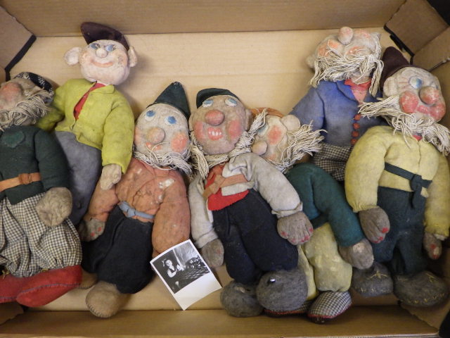 Seven artisan made Disney style dwarfs Image