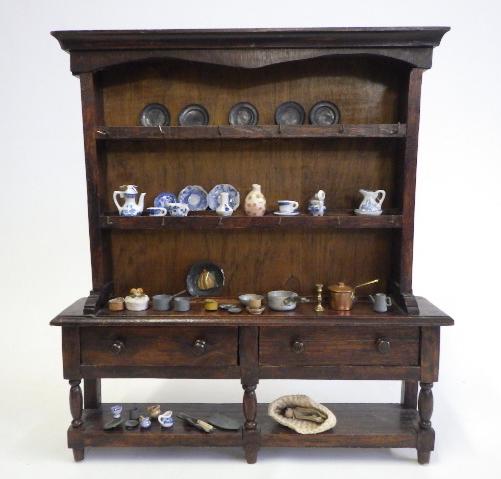 An antique doll's oak dresser Image