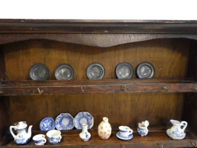 An antique doll's oak dresser Image