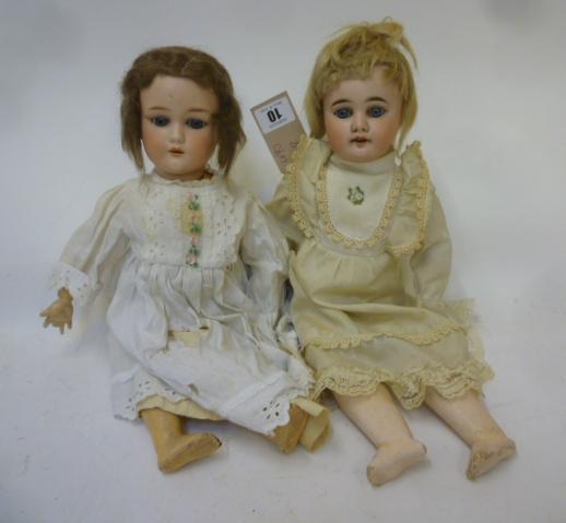 A German bisque head doll with blue glass eyes Image