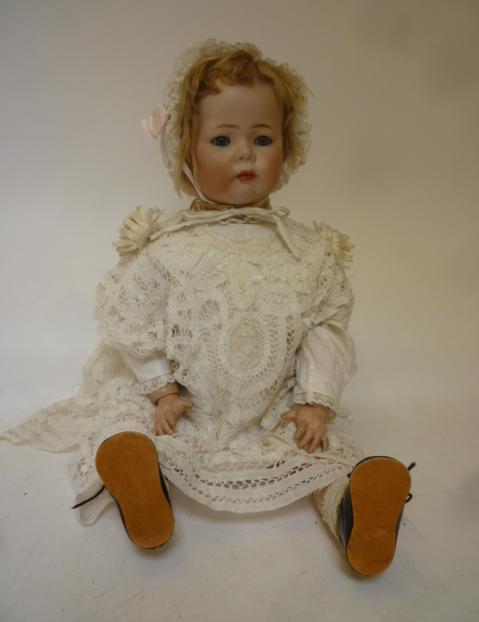 A Kammer & Reinhardt bisque head character doll with blue glass sleeping eyes Image