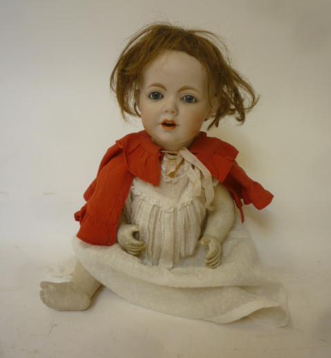 A German bisque head character doll with fixed blue glass eyes Image