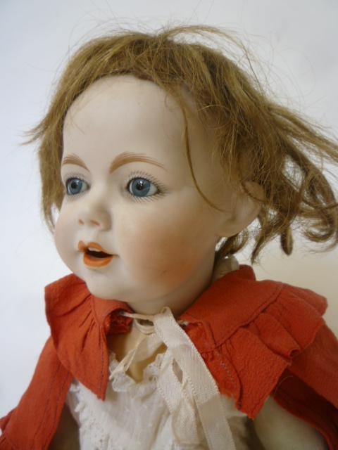 A German bisque head character doll with fixed blue glass eyes Image