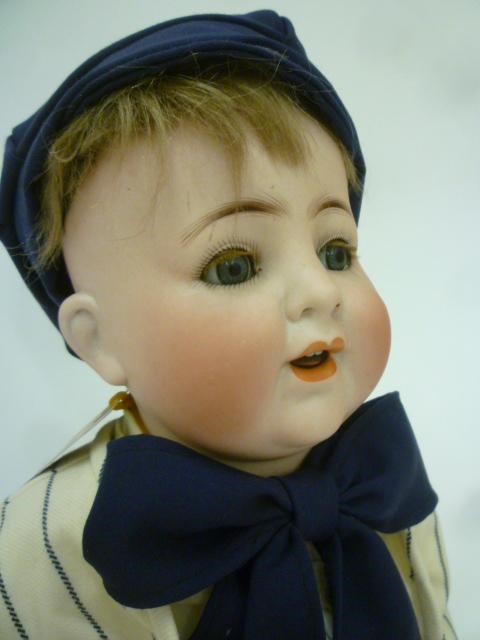 An Alt Beck & Gottschalck bisque head body character doll with blue glass sleeping eyes Image