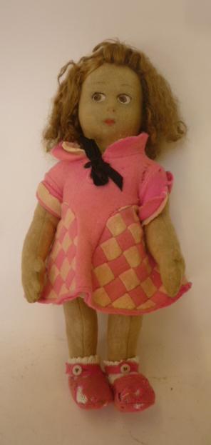 A Lenci felt covered doll with moulded painted face Image