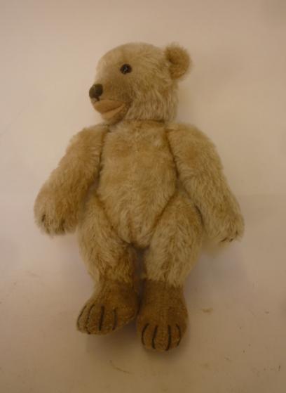 A German standing teddy bear covered in fawn plush Image