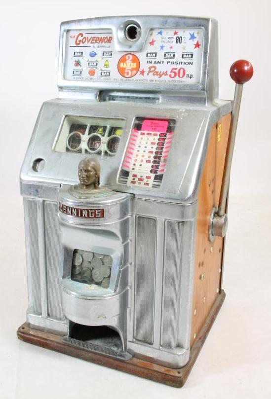 A Jennings "Governor" fruit machine with chromium plated metal and wood case Image