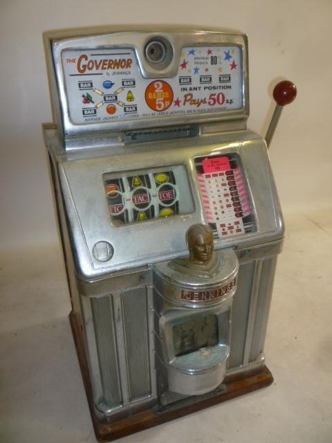 A Jennings "Governor" fruit machine with chromium plated metal and wood case Image