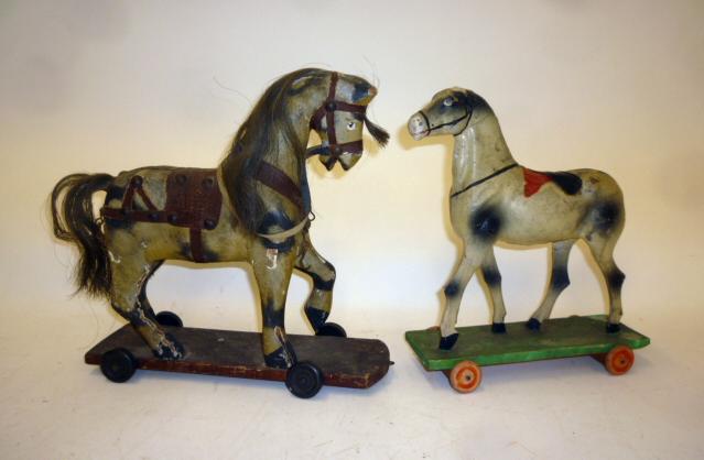 A toy carthorse on wheels Image