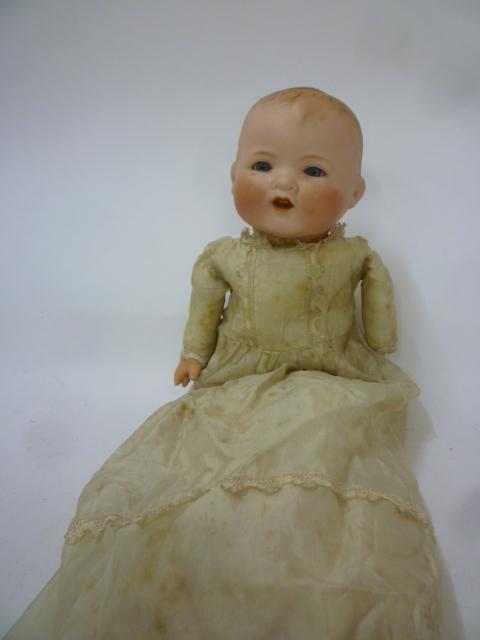 An Armand Marseille "Baby Gloria" bisque head baby doll with blue glass sleeping eyes Image