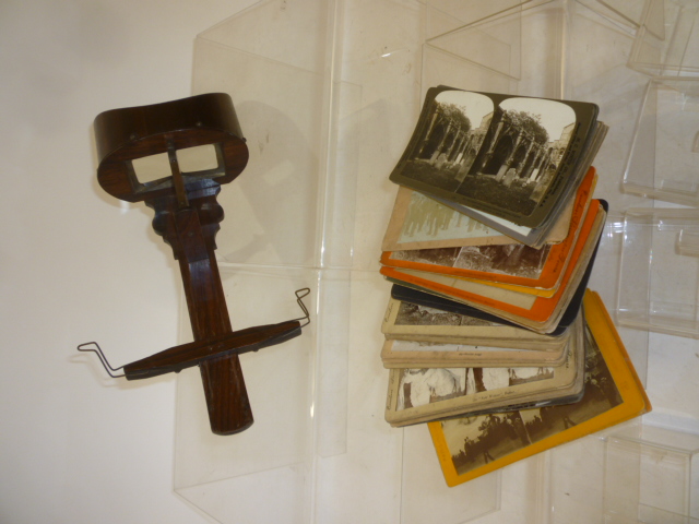A rosewood hand held stereoscope viewer Image