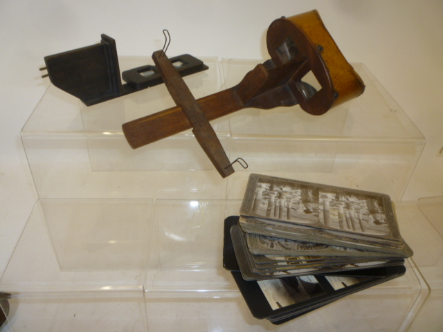 A stained wood hand held stereoscope viewer Image