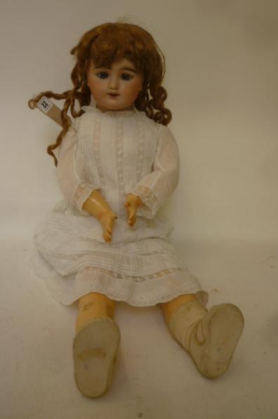 An S.F.B.J. "Eden Bebe" bisque head doll with fixed blue glass paperweight eyes Image