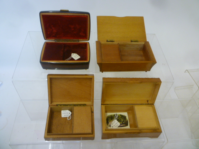 Four musical cigarette boxes comprising marquetry inlaid box with Lador movement Image