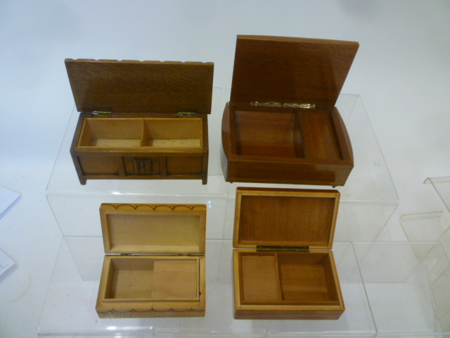 Three musical cigarette boxes comprising a string inlaid mahogany box with marquetry lid Image