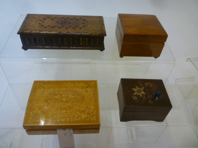 Four musical cigarette boxes comprising an oak carved box Image