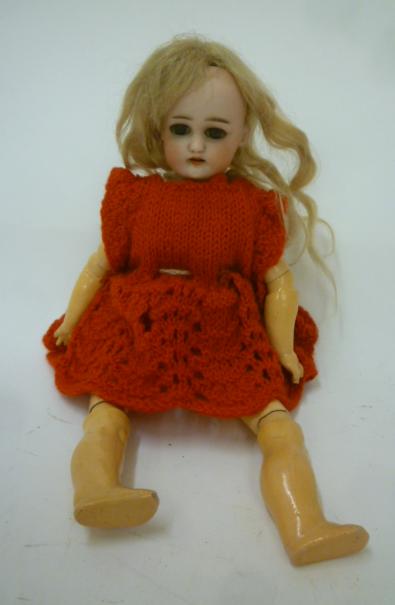 A Simon & Halbig bisque head doll with brown glass sleeping eyes Image