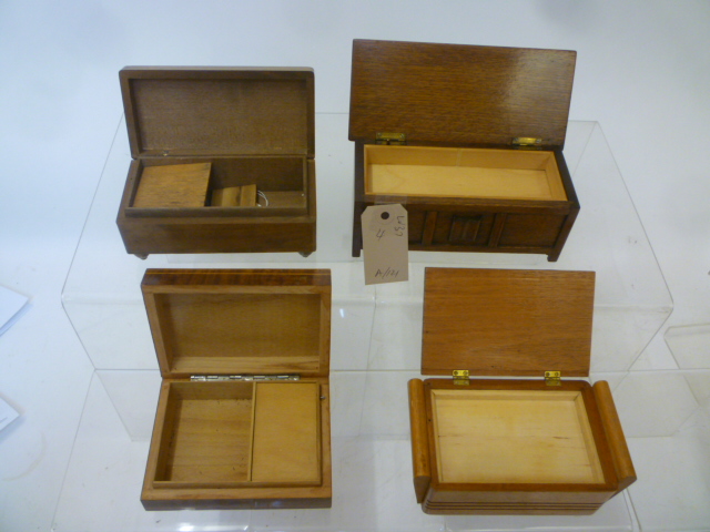 Four musical cigarette boxes comprising string inlaid box with marquetry lid Image