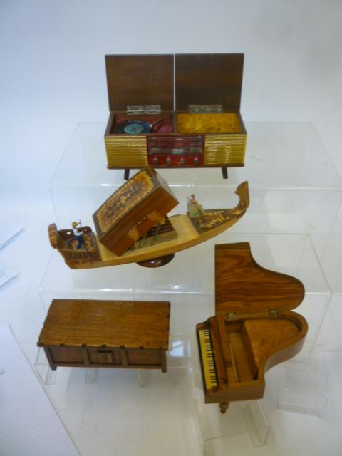 Four novelty musical cigarette boxes comprising a gondola in satin birch and marquetry inlaid lid Image