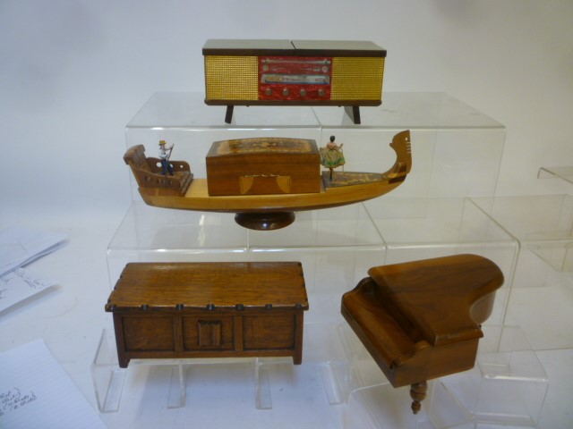 Four novelty musical cigarette boxes comprising a gondola in satin birch and marquetry inlaid lid Image