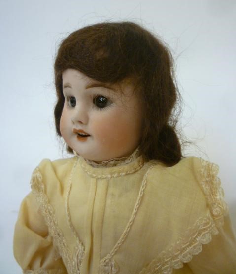 An S.F.B.J. bisque head doll with brown glass sleeping eyes Image