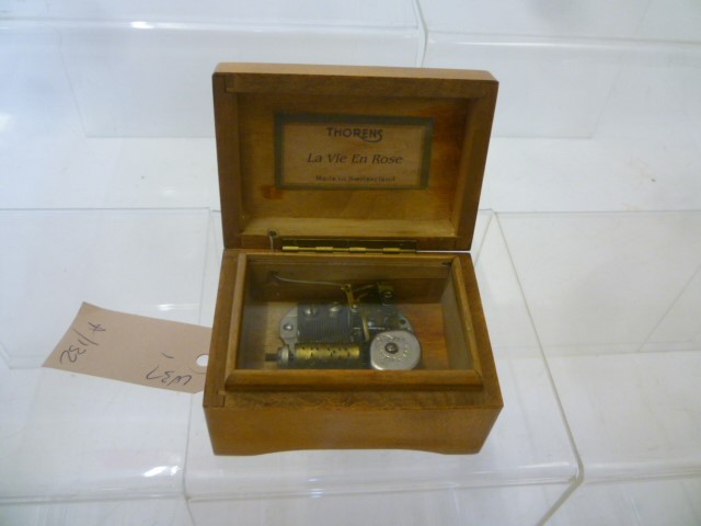 A Swiss miniature musical box with comb and drum movement by Thorens in beech wood case Image