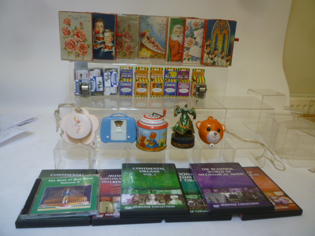 Six small hand cranked musical boxes by Tobar in card boxes Image