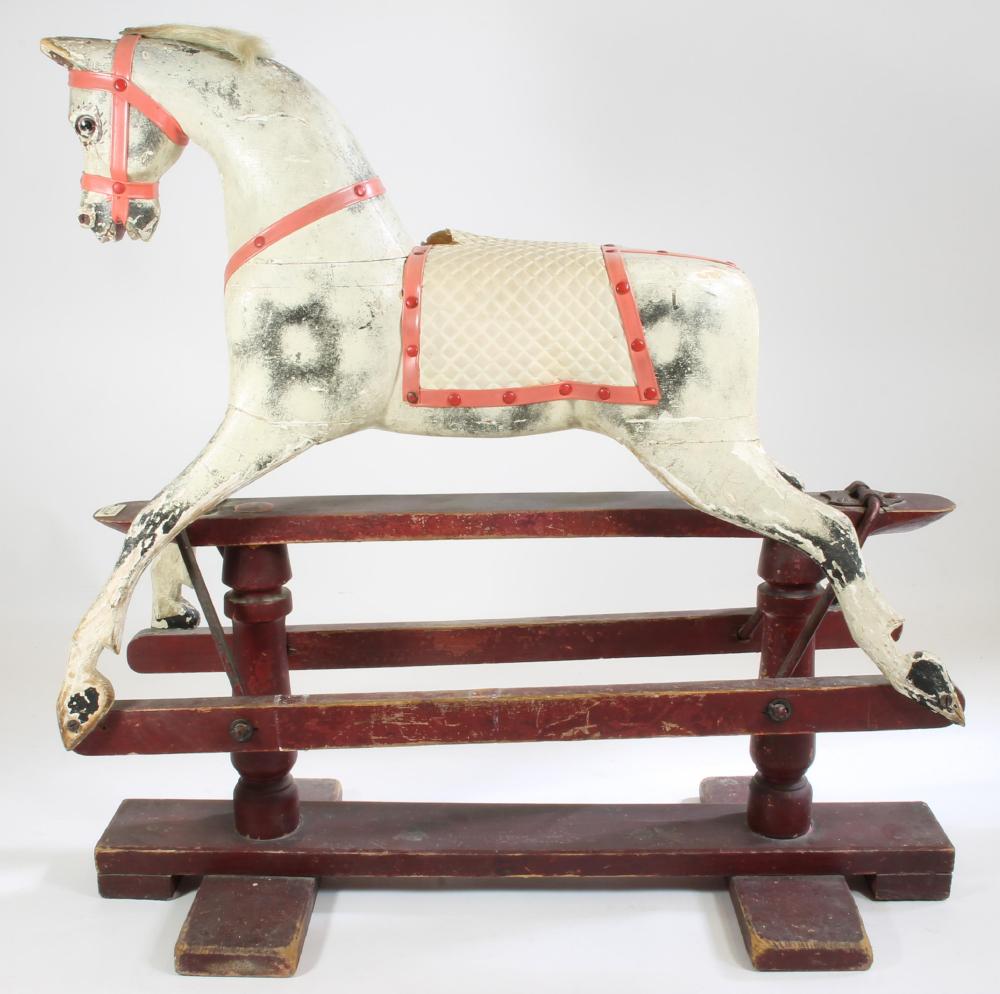 An AJOY Ltd small rocking horse on safety stand Image
