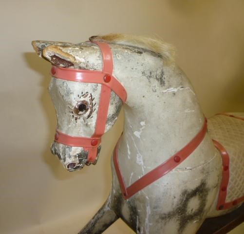 An AJOY Ltd small rocking horse on safety stand Image