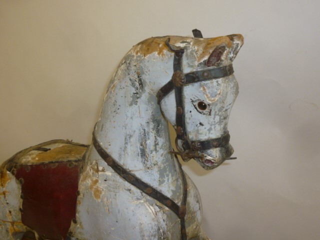 A rocking horse on safety stand by Baby Carriages Ltd Image