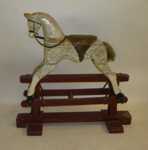 A small rocking horse on safety stand Image