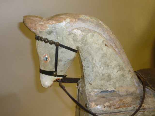 A small rocking horse on safety stand Image