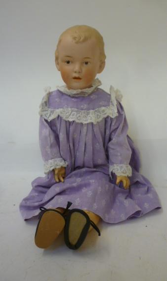 A Gebruder Heubach bisque head doll with painted face Image