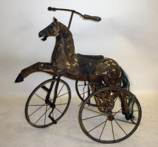 A reproduction tricycle horse Image