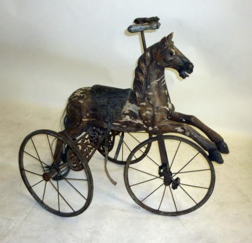 A reproduction tricycle horse Image