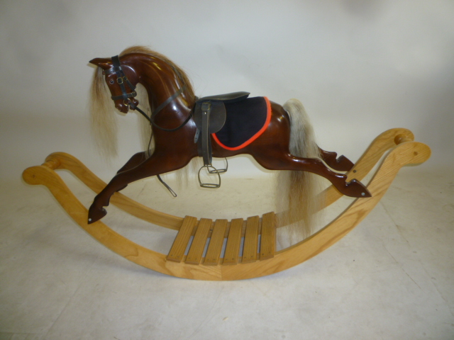 A small rocking horse by Anthony Dew in carved Brazilian mahogany with black/clear glass eyes Image