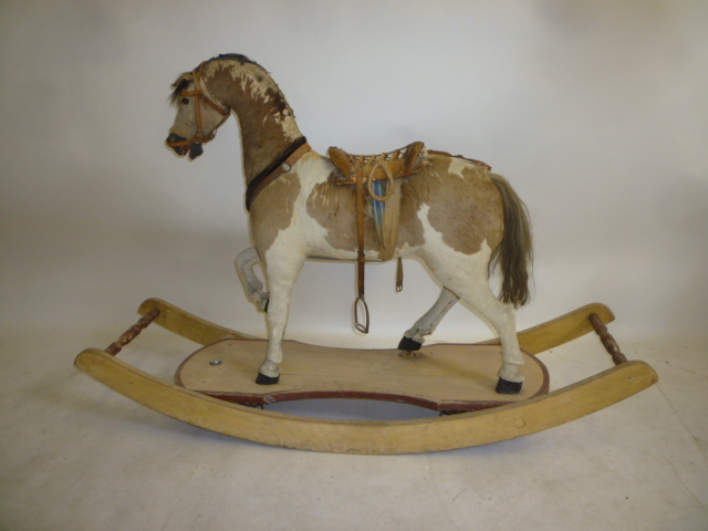 A medium rocking horse on convertible stand Image