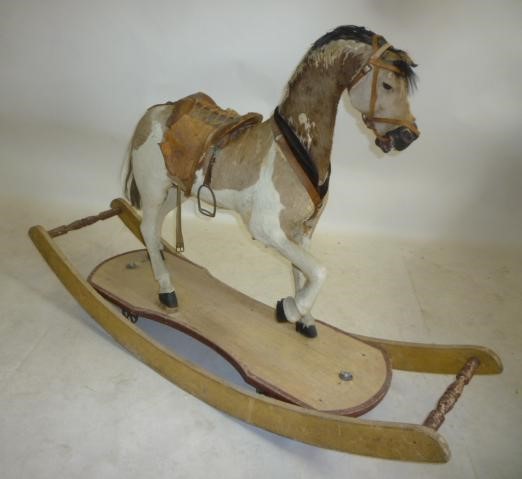 A medium rocking horse on convertible stand Image