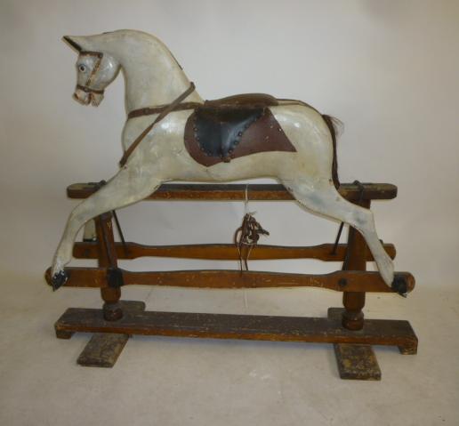 A medium rocking horse on safety stand Image