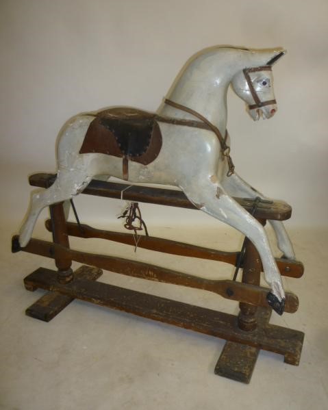 A medium rocking horse on safety stand Image